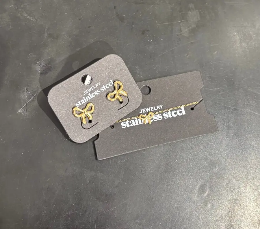 Set roestvrij stalen strikknoopoorbel en armband bow life